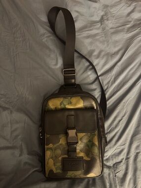 Coach Men’s Green Camo and Brown Leather Sling Bag